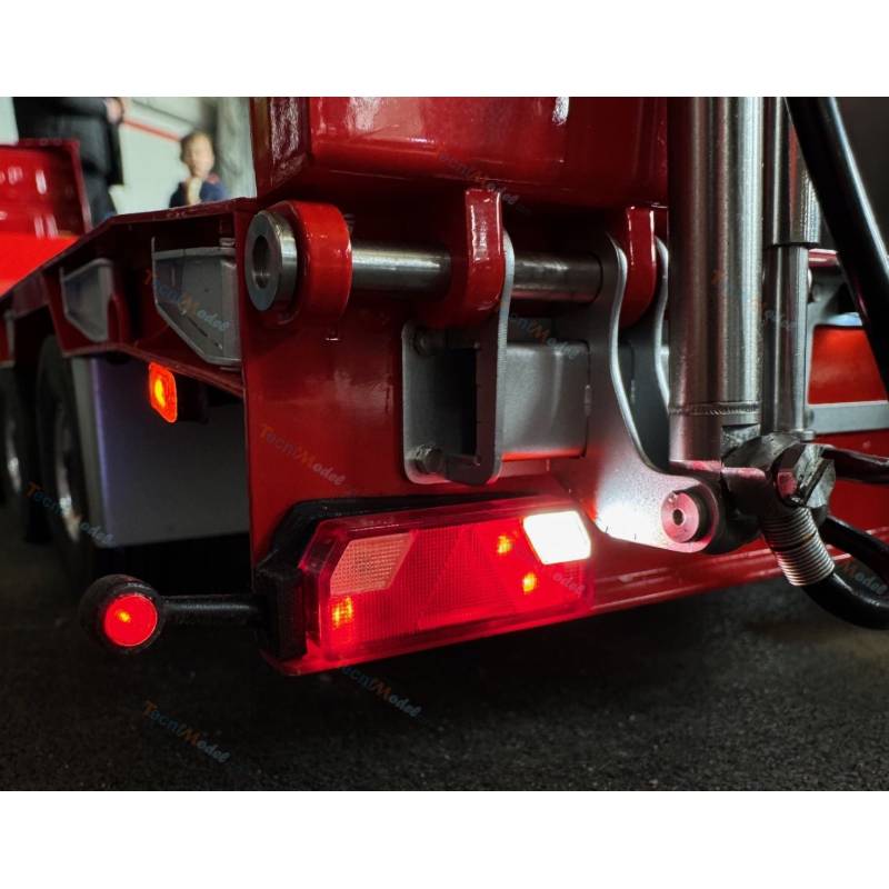 Pair of flexible side marker lights mounted on 7-compartment trailer light brackets